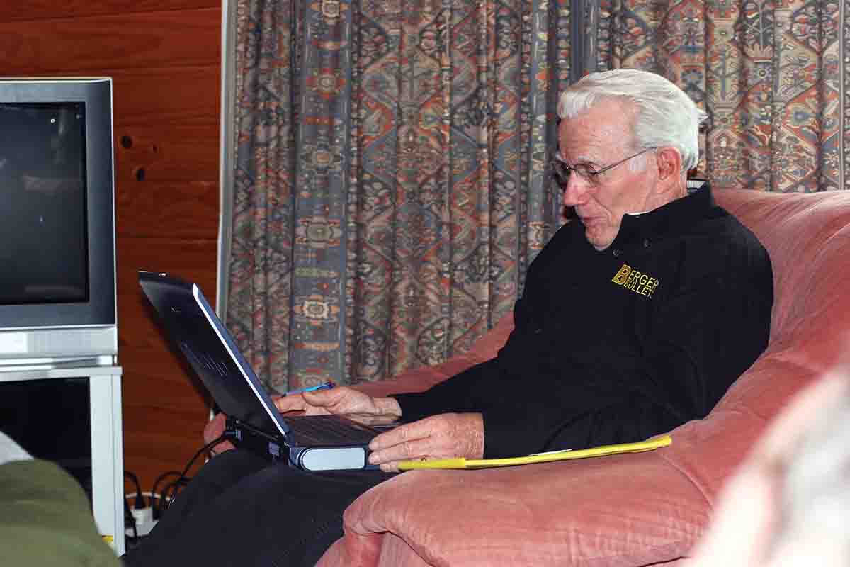 The late Walt Berger, a member of the Benchrest Hall of Fame, always obsessed over accuracy. Here, he looks up some information on his laptop at a hunting lodge in New Zealand.